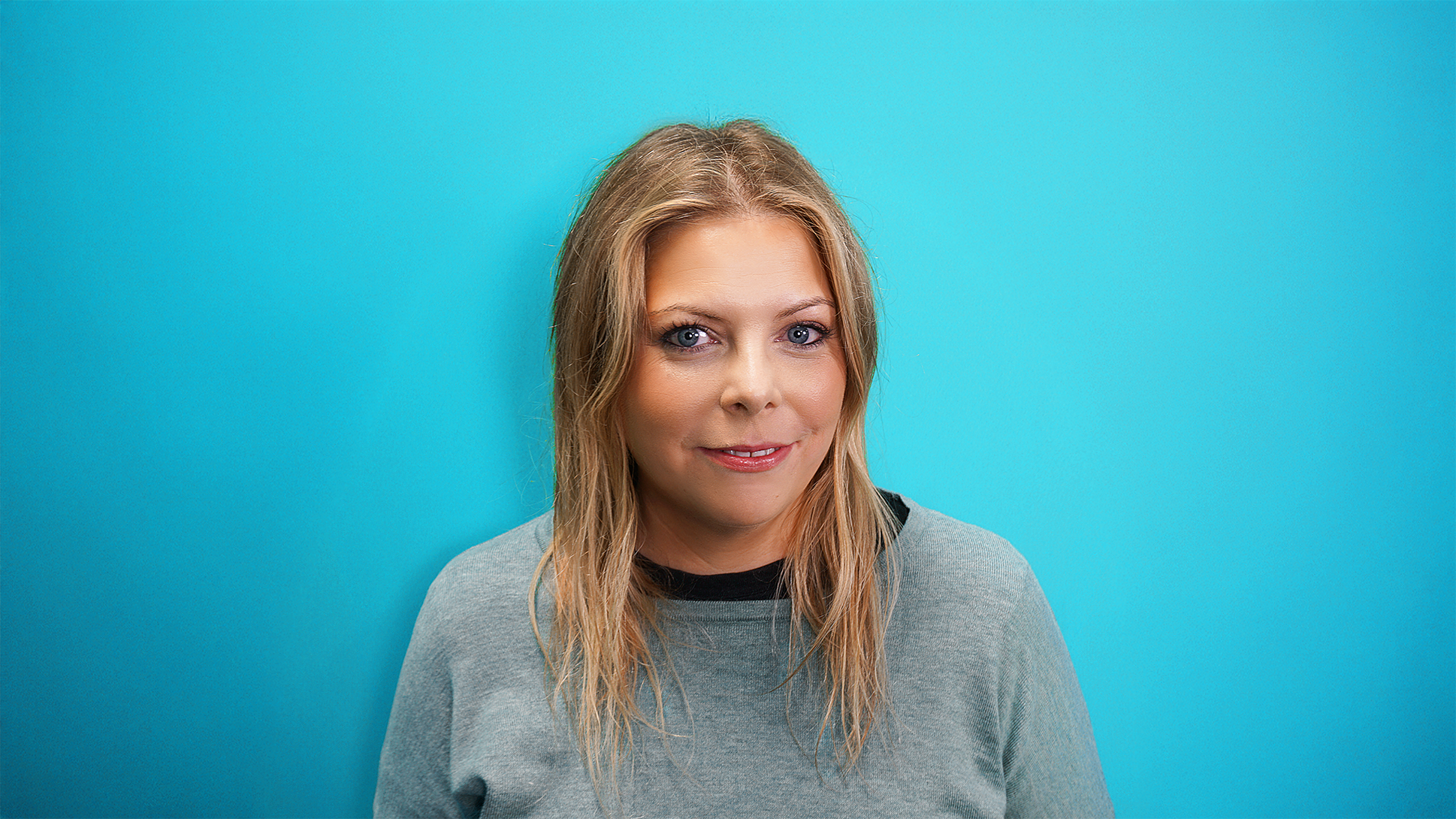 Image of Timea Edvi on a blue background